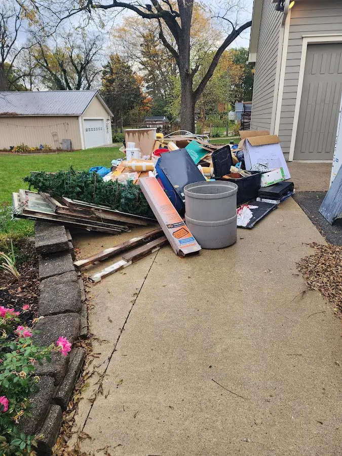 Dumpster being loaded with debris for Roofing Dumpster Rental in Springville